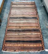 Eastern striped floor rug in peaches, oranges, brown and creams, 242cm x 122cm