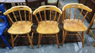 Set of three 20th century spindleback dining chairs on turned supports and stretchered bases (3)