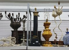 Two large black and ormolu style pillared table lamps, pair of gilt table lamps, a pair of metal