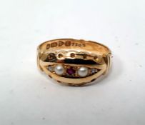 18ct gold, ruby, seedpearl and diamond ring set centre ruby flanked by pair seedpearls and pair tiny