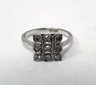 Platinum and diamond pave set ring, shaped square, with three rows of three each small diamonds,