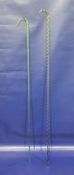 Two glass walking sticks, one of green glass with twisted design and gilt decoration, 104cm long and