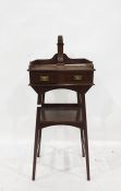 Early 20th century mahogany washstand with hexagonal mirror, raised upon a brass pole, above the