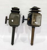 Brass and black japanned coaching lamp and another similar (2)