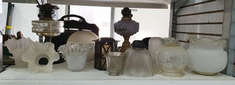 Victorian brass, clear and black glass oil lamp with cut glass well, gilt metal and purple opaque