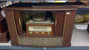 A radiogram within original cabinet made by Ferguson, sliding doors, 97 cms wide 62 cms high approx