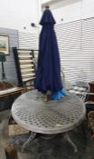 A grey painted metal garden table, lattice top wit