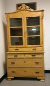 20th century pine dresser cabinet with arched top above two glazed doors, enclosing shelves, above