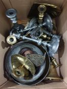 Brass lilypad chamberstick, an ebonised handled and brass hand bell, candlesticks and other metal