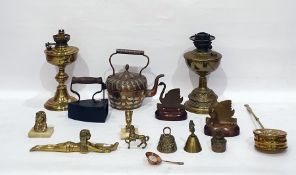 Brass inlaid copper kettle with stylised floral and foliate decoration, a pair of swan models, brass