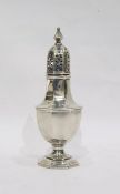 Silver sugar caster by Henry Matthews, Birmingham 1920, of panelled octagonal form on pedestal foot,