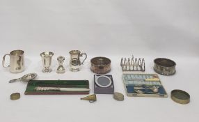 Pair of silver plated wine coasters with wooden bases and a silver plated pepper grinder, a cased