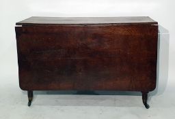 19th century oak drop-leaf dining table raised upon turned supports to brass caps and castors 111