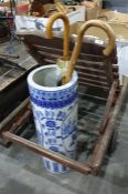 Large ceramic blue and white Chinese style umbrella stand/stick stand containing a walking stick and