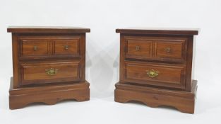 20th century pair of pine bedside chests of two drawers