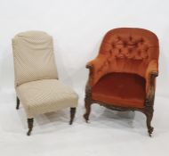 Early Victorian low button back salon chair, the acanthus carved hand rests above the serpentine-