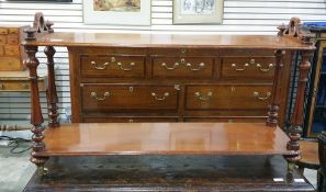 Early Victorian mahogany two-tier whatnot of narrow rectangular form, the turned supports uniting