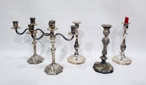 Pair of three-branch electroplated candelabra, a pair of electroplated candlesticks and another