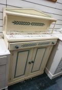 Painted chiffonier, the cream ground tile top above a single drawer and two cupboard doors, to