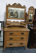 Early 20th century walnut dressing chest, the three-part mirrored superstructure above three