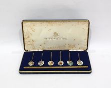Set of six silver gilt and floral enamel coffee spoons, the bowls with basse taille enamelling of