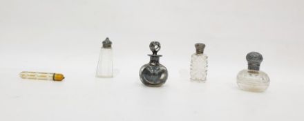 Cut glass scent bottle with embossed silver cover, a glass scent bottle with silver overlay,