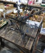 Two weather vanes, one with a pig and piglet, the