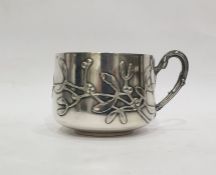 French silver mug, maker's mark 'CM' with a rose between, of shallow form decorated with mistletoe