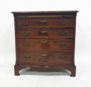 20th century mahogany serpentine-fronted bachelor's chest, the moulded edge above brushing slide and