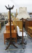 20th century mahogany hat and coat stand on faceted and fluted central column to triform base and