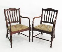 Pair of 20th century mahogany framed armchairs, the slat backs above needlework upholstered seats,