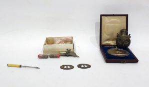 Snuff bottle embossed as a head of a long eared owl, a medal marked Dignissimo 1842, possibly a