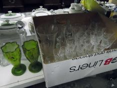 Assorted cut glass wines including brandy balloons, three decanters, Victorian green glass painted