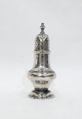 Victorian silver pepperette, Birmingham 1886, pear-shaped and crested, on circular foot, makers