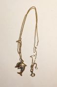Two-colour dolphin pendant on fine gold curb link chain, marked 375, total weight 2g