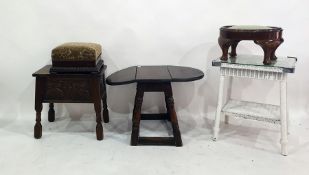 Oak coffee table with drop leaves, a wicker two-tier coffee table, two stools and an oak lift-top