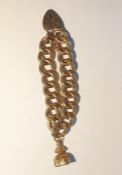 Gold coloured engraved curb link bracelet hung wit