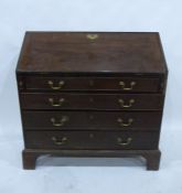 A 19th century mahogany bureau of four long drawers, to bracket feet, brass handle and escutcheon,