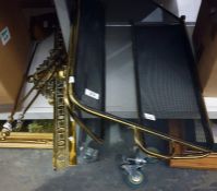 A folding brass and wire spark guard, brass fire companions and part of a brass fire curb