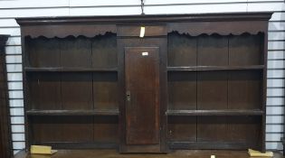 An 18th century and later North Country oak and cross-banded dresser top with assorted shelves and