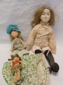 A replica of a Victorian papiermache doll, with a foam body, together with a 'country' doll and a