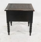 20th century oak lift-top box with carved top opening to reveal the interior, on bobbin turned