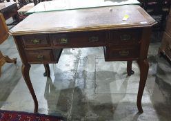 Early 20th century mahogany writing desk, the rectangular top with canted corners and moulded