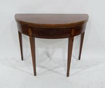A 19th century mahogany demi-lune tea table, the foldover top above single drawer, with inlaid