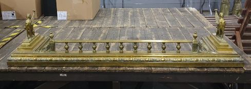 Brass fire curb in the Egypto Classical taste with fire dogs to either end, in the form of caryatid,