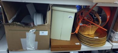 Seven gilt serving platters, an enamel bread bin, an orange retro table lamp, assorted ceramics