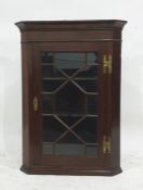 A 19th century mahogany wall-hanging astragal-glazed doored corner cabinet