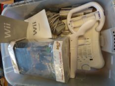 Wii console together with Wii fit board, wii fit and Medal of Honour Heroes 2 and Danger Girl