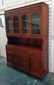 A 20th century Oriental rosewood dresser with four glazed doors enclosing shelves, above base of