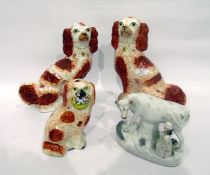 Pair Victorian Staffordshire spaniels with iron-red markings, another and a Victorian